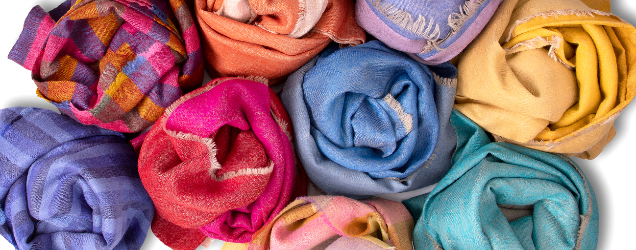 A selection of brightly coloured striped and reversible pashmina shawls