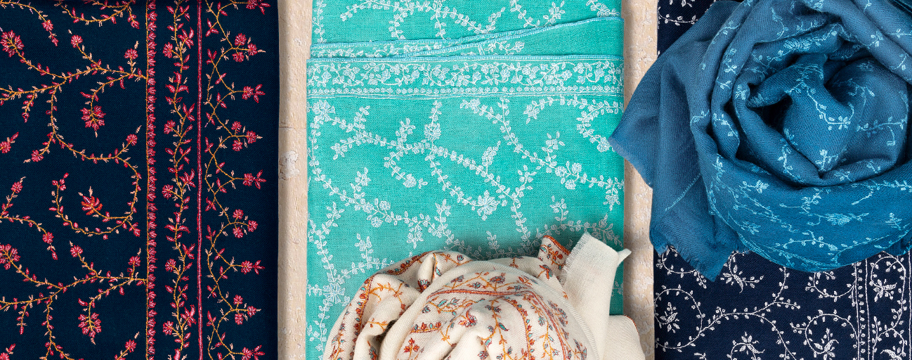 Pashmina shawls with all over embroidery in shades of blue and green