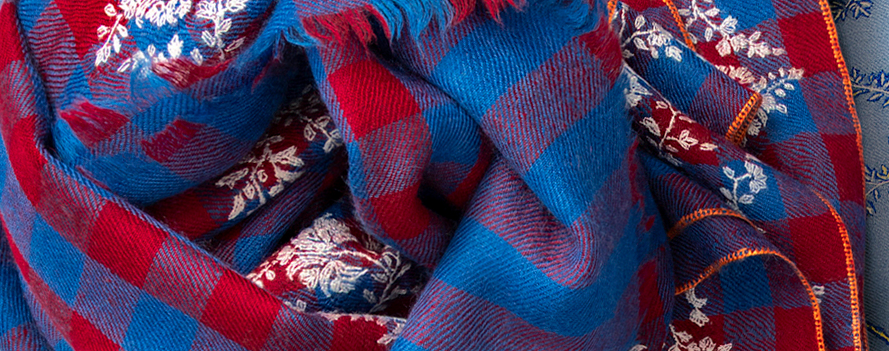 Red and blue striped and embroidered pashmina shawl.