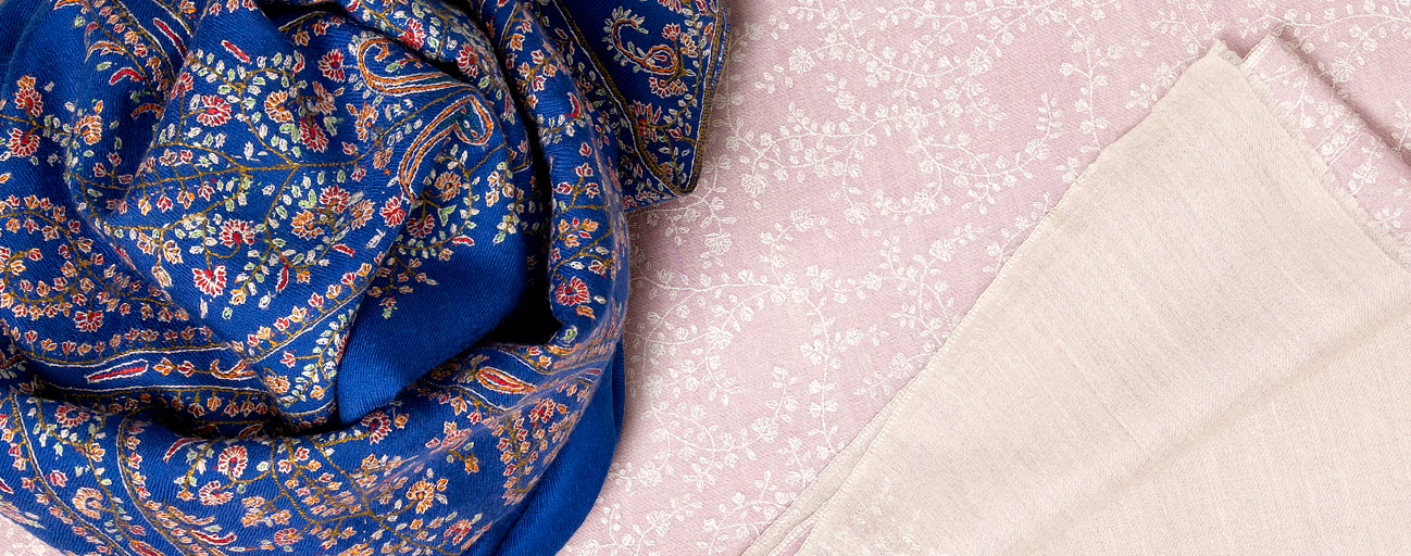 Pale pink and navy blue pashmina shawls with exquisite complex emboidery all over.
